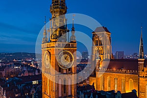 Beautiful clock of the town hall in Gdansk at night, Poland