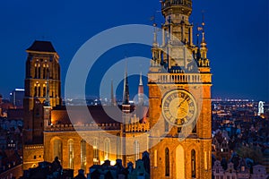Beautiful clock of the town hall in Gdansk at night, Poland