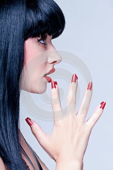 Beautiful close up profile of young lady with perfect nails