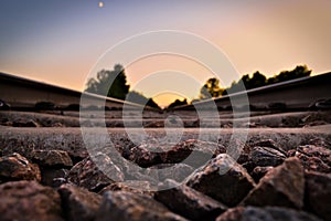 Beautiful close-up of track ballast with sunset background.