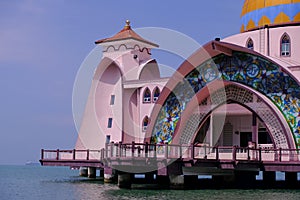 Beautiful close up view of Melaka Straits Mosque, located on the man-made Malacca Island, which appears floating on the sea when