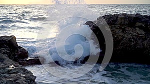 Beautiful close-up view of the sea waves. The waves roll powerfully on the water surface