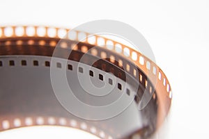 A beautiful closeup of an analogue photo film on a white background.