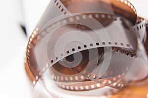 A beautiful closeup of an analogue photo film on a white background.