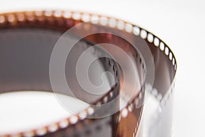 A beautiful closeup of an analogue photo film on a white background.