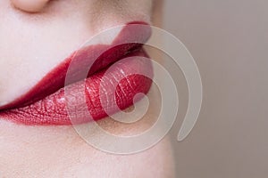 Beautiful closeup female plump lips with bright color makeup