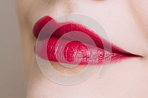 Beautiful closeup female plump lips with bright color makeup