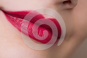 Beautiful closeup female plump lips with bright color makeup