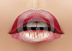 Beautiful Closeup with Female Plump Lips with Shiny Pink Makeup. Fashion Celebrate Make-up, Glitter Cosmetic