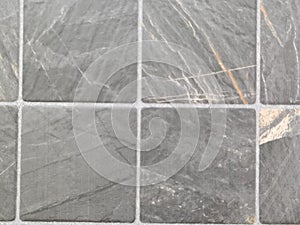 Beautiful closeup textures abstract color gray and white tiles granite and gray marble pattern wall on white background and wood