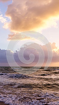 Beautiful cloud coastline background. Fiery orange sunset sky. Amazing sunrise on the beach in Miami. Fantastic