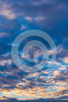 Beautiful clouds in blue sky, illuminated by rays of sun at colorful sunset to change weather. Abstract meteorology