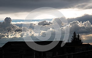 Beautiful clouds in the blue sky over the village, nature background in summer