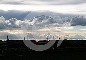 Beautiful clouds in the blue sky over the village, nature background in summer