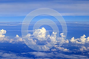 Beautiful clouds in the blue sky, the sun behind the cloud, a thunder cloud