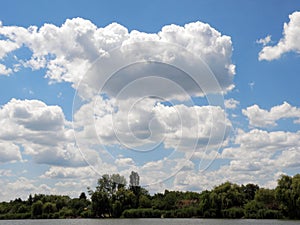 Beautiful clouds over the river at summer