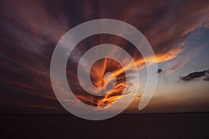Beautiful clouds over the salt lake in sunset