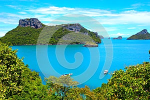 Beautiful clouds shores and blue ocean, mountin green trees