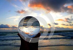 Beautiful clouds during sunrise captured through a lens ball at Fort Lauderdale Beach, Florida, U.S.A