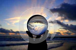 Beautiful clouds during sunrise captured through a lens ball at Fort Lauderdale Beach, Florida, U.S.A