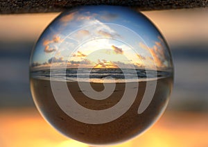 Beautiful clouds during sunrise captured through a lens ball at Fort Lauderdale Beach, Florida, U.S.A