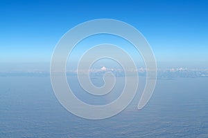 Beautiful cloudscape with magic halo from plane window