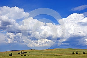 Beautiful cloudscape over rolling green hills