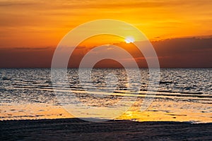 Beautiful cloudscape over the sea, scenic dramatic golden sunset