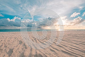 Beautiful cloudscape over the sea, sunrise horizon sand waves. Idyllic inspirational beach landscape