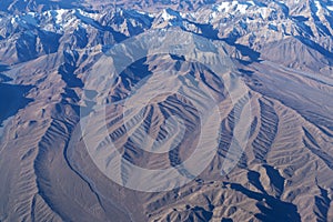 Beautiful cloudscape and snow mountains from plane window