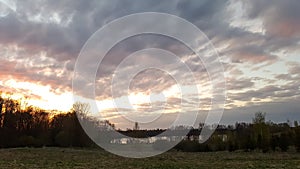 Beautiful cloudscape. Sunset landscape with forest.
