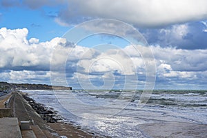 Beautiful cloudy skies over the landing beaches of Omaha Beach near the village of Vierville-sur-mer in Normandy, France