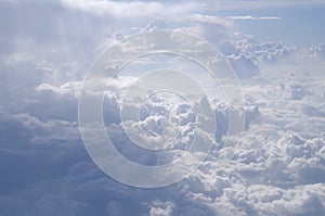 Beautiful cloudy sky from aerial view background. Airplane view above clouds. Sky and cloud texture