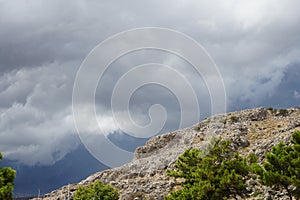 Beautiful cloudy sky over a hill in the vicinity of Pefki in August. Pefkos or Pefki, Rhodes photo