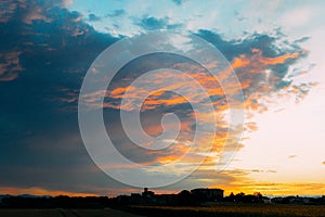 Beautiful cloudy sky with sun rays. Cloudy abstract background. Sunset light.