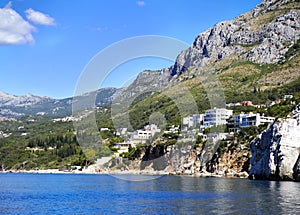 The beautiful coast of Montenegro near Budva Riviera - the view from the sea to the beaches and towns is an unforgettable experien