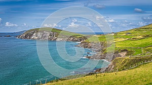 Beautiful coastline with cliffs and turquoise water in Dingle