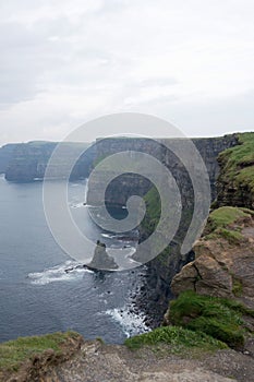 Beautiful coastline on a rainy day. Moher cliffs and athlantic ocean, Ireland,