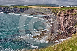 Beautiful coastline at the Ring of Kerry, Ireland. Huge cliffs at the Ring of Kerry Ireland. View on the Skellig Islands