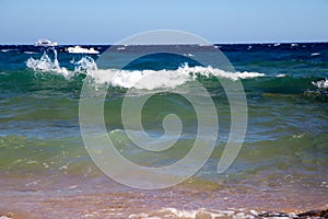 Beautiful coastline with sand and water. blue sea wave photograph close up. vacation at sea or ocean. Background to insert images
