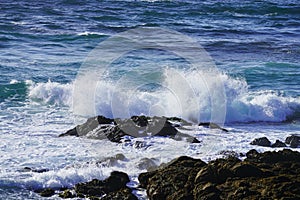 Beautiful coastline scenery with ocean waves and rocks cliff on Pacific Coast