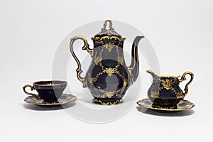 Beautiful cobalt blue colored vintage porcelain tea set with gold ornament