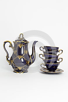 Beautiful cobalt blue colored vintage porcelain tea set with gold ornament