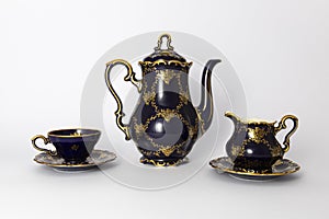 Beautiful cobalt blue colored vintage porcelain tea set with gold ornament