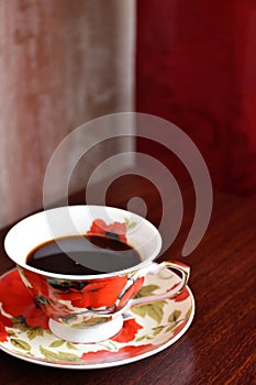 Beautiful coffee service with red poppies on the table.