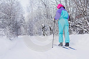 Beautiful cold forest view of ski run track on ski resort, winter day on a slope, pist, nordic skier on the track in winter,