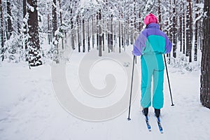 Beautiful cold forest view of ski run track on ski resort, winter day on a slope, pist, nordic skier on the track in winter,