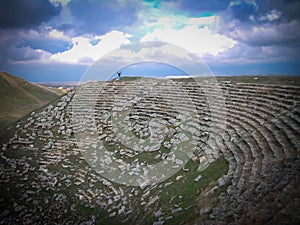 Beautiful coliseum in Laodicea arena with a man with arms up
