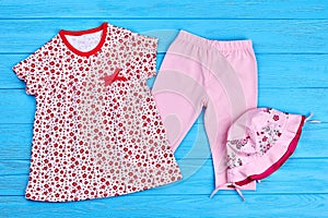 Beautiful collection of baby-girl clothes.