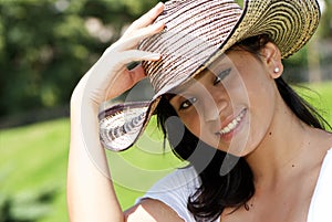 The beautiful Colombian girl in a hat photo